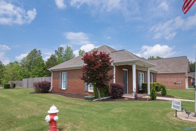 view of front of house featuring brick siding and a shingled roof