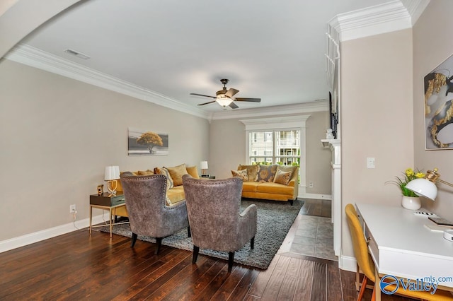 living room featuring hardwood / wood-style floors, crown molding, baseboards, and visible vents