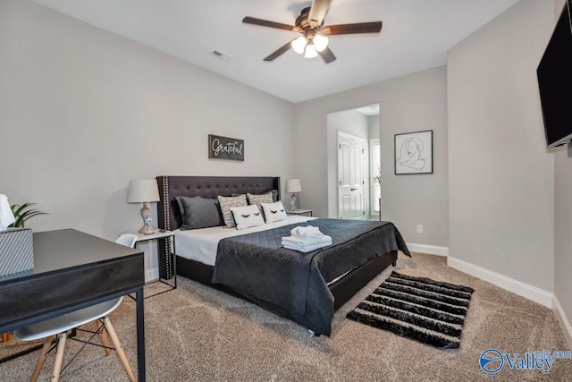 bedroom with visible vents, baseboards, ceiling fan, and carpet flooring