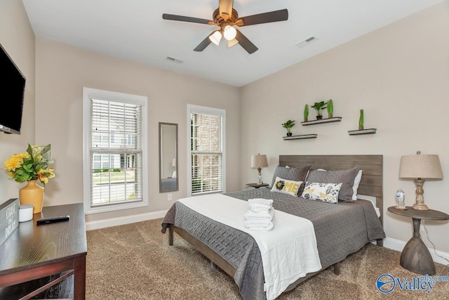 bedroom featuring ceiling fan, carpet, visible vents, and baseboards