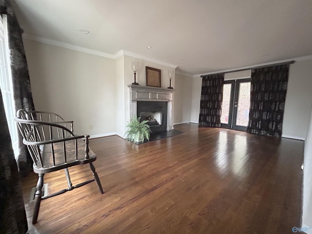 living room with ornamental molding, dark hardwood / wood-style flooring, and french doors