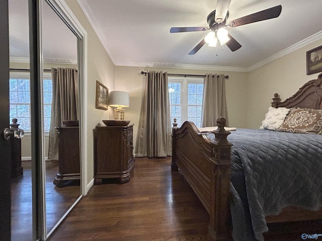 bedroom featuring crown molding, dark wood-type flooring, a closet, and ceiling fan