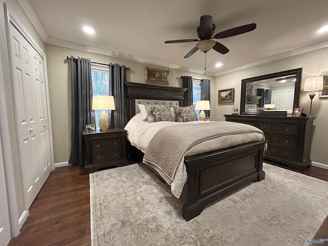 bedroom featuring crown molding, dark wood-type flooring, and ceiling fan