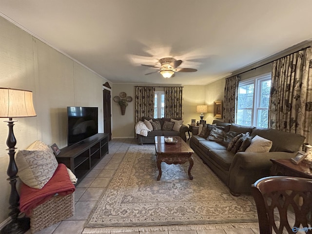 living room featuring crown molding, ceiling fan, plenty of natural light, and light tile patterned floors