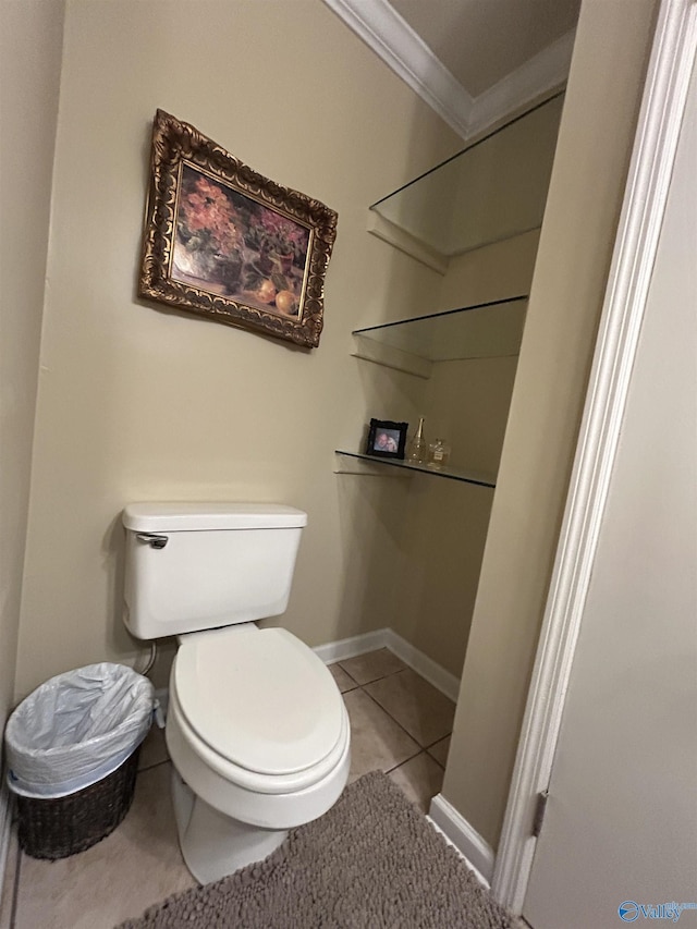 bathroom with ornamental molding, tile patterned floors, and toilet