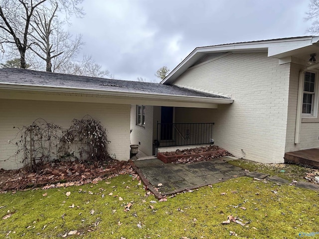 entrance to property with a yard