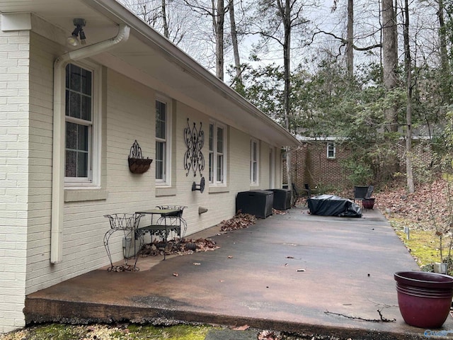 view of side of property featuring a patio area