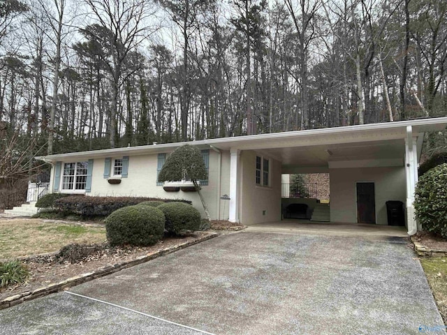 view of front of home featuring a carport