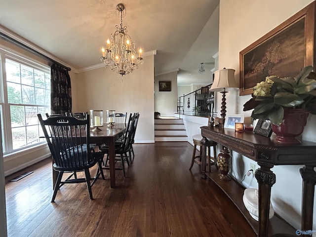 dining space with ornamental molding, dark hardwood / wood-style flooring, and a notable chandelier