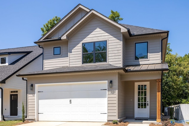 view of front of property with cooling unit and a garage