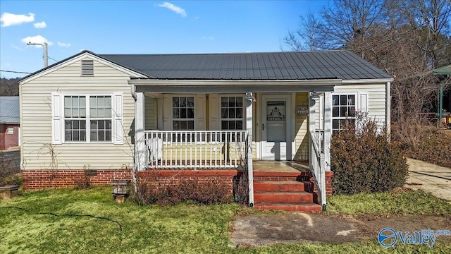 bungalow-style home with a porch and a front yard