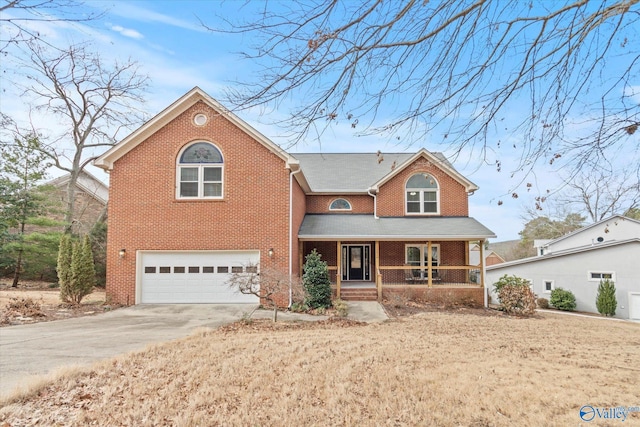 view of front of house featuring a garage and covered porch