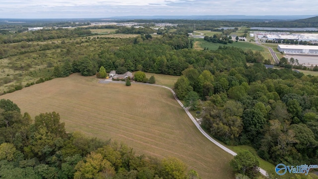 birds eye view of property with a rural view