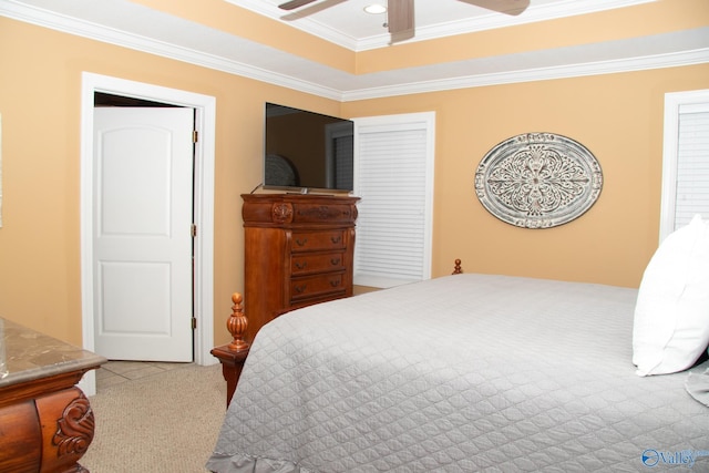 bedroom with a raised ceiling, a ceiling fan, crown molding, recessed lighting, and carpet flooring
