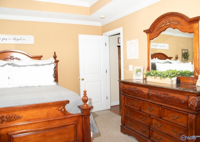 bedroom with ornamental molding and carpet