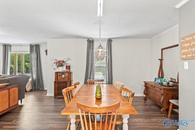 dining area with a textured ceiling, wood finished floors, and baseboards