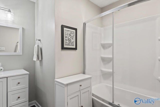 bathroom with enclosed tub / shower combo and vanity