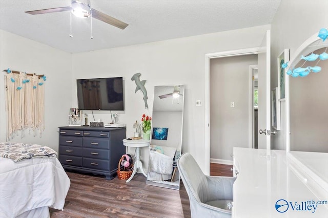 bedroom featuring dark wood-style floors and a ceiling fan