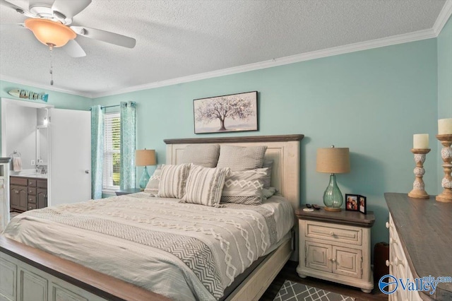 bedroom featuring ensuite bath, a textured ceiling, ceiling fan, and ornamental molding