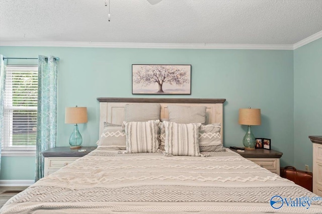 bedroom featuring crown molding, a textured ceiling, and baseboards