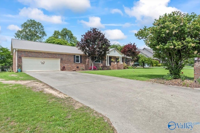 single story home featuring driveway, a front lawn, brick siding, and an attached garage