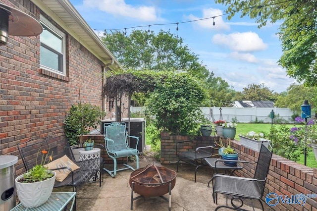 view of patio / terrace featuring a fire pit and a fenced backyard