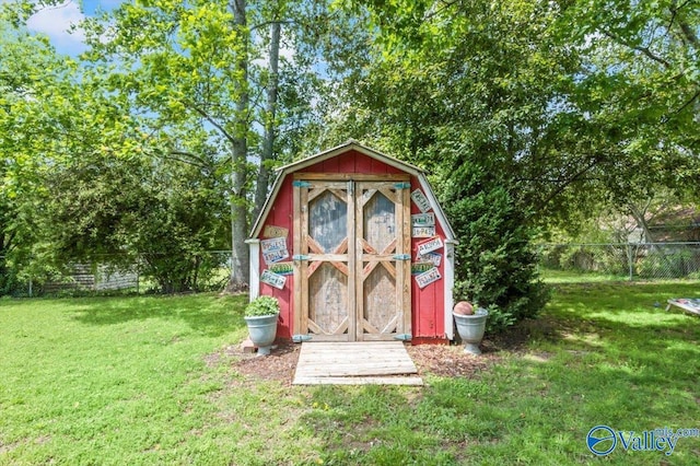 view of shed with fence