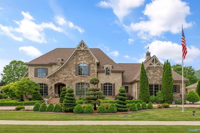 3 Mcmullen Ln, Gurley, AL 35748 - french country style house with stone siding, a front lawn, a chimney, and a shingled roof