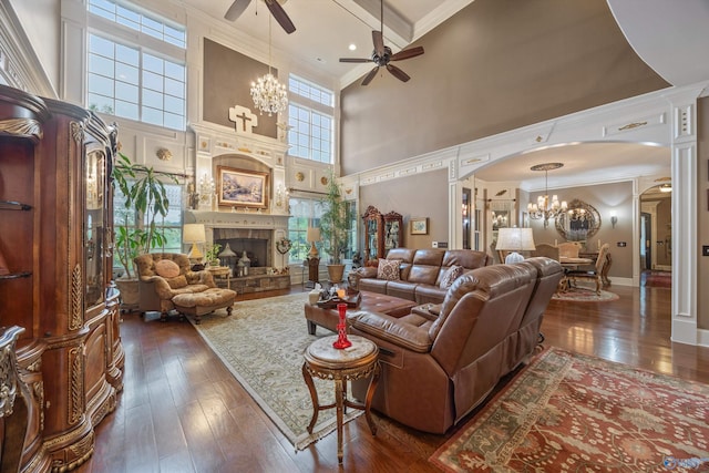3 Mcmullen Ln, Gurley, AL 35748 - living area featuring a chandelier, a ceiling fan, arched walkways, a high ceiling, and dark wood-style flooring