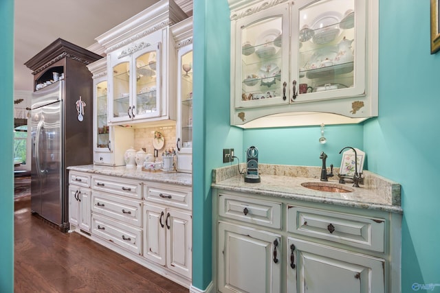 3 Mcmullen Ln, Gurley, AL 35748 - indoor wet bar featuring dark wood finished floors, tasteful backsplash, and stainless steel built in refrigerator