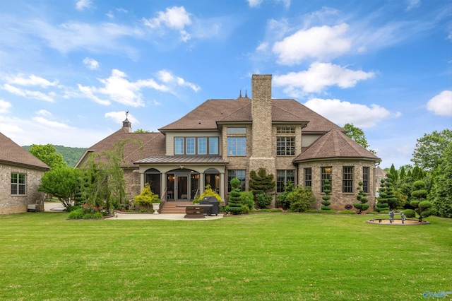 3 Mcmullen Ln, Gurley, AL 35748 - back of property with a chimney, a yard, a patio area, and stone siding