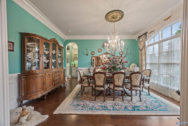 3 Mcmullen Ln, Gurley, AL 35748 - dining area with a chandelier, a wainscoted wall, crown molding, wood finished floors, and arched walkways