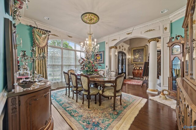 3 Mcmullen Ln, Gurley, AL 35748 - dining room featuring decorative columns, arched walkways, a chandelier, ornamental molding, and wood finished floors