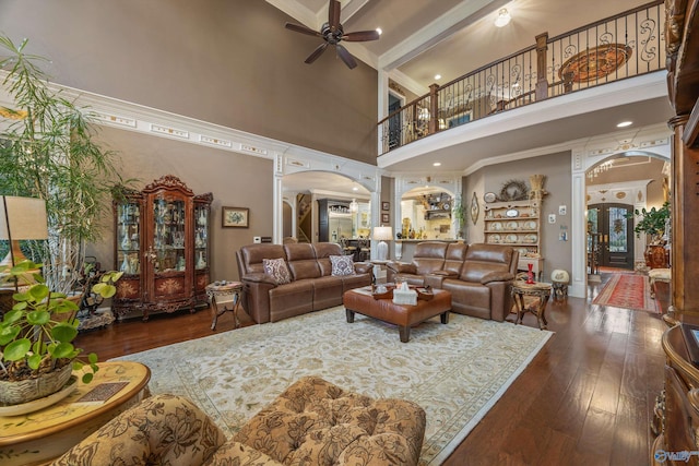 3 Mcmullen Ln, Gurley, AL 35748 - living area with arched walkways, a towering ceiling, ceiling fan, hardwood / wood-style flooring, and crown molding