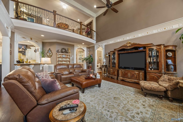 3 Mcmullen Ln, Gurley, AL 35748 - living area featuring a high ceiling, crown molding, ceiling fan, wood finished floors, and arched walkways