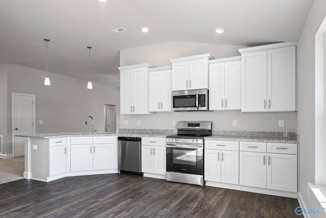 kitchen with visible vents, lofted ceiling, a peninsula, stainless steel appliances, and white cabinetry