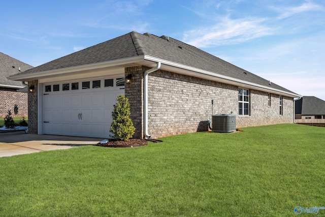 view of home's exterior with a yard, a shingled roof, concrete driveway, central AC, and a garage