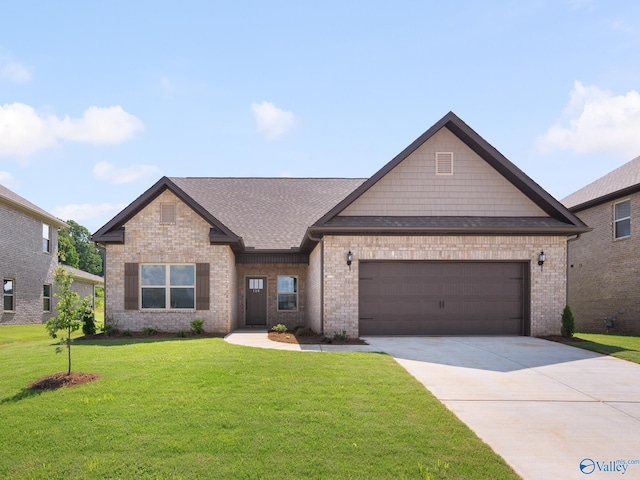 183 Saddle St, New Market, AL 35761 - view of front of home featuring roof with shingles, an attached garage, driveway, a front yard, and brick siding