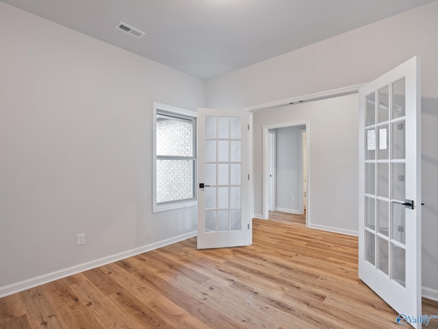 183 Saddle St, New Market, AL 35761 - spare room with baseboards, visible vents, french doors, and light wood-style floors
