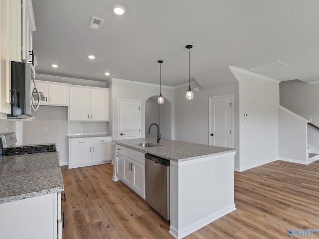 183 Saddle St, New Market, AL 35761 - kitchen with visible vents, a sink, light wood-style floors, and appliances with stainless steel finishes