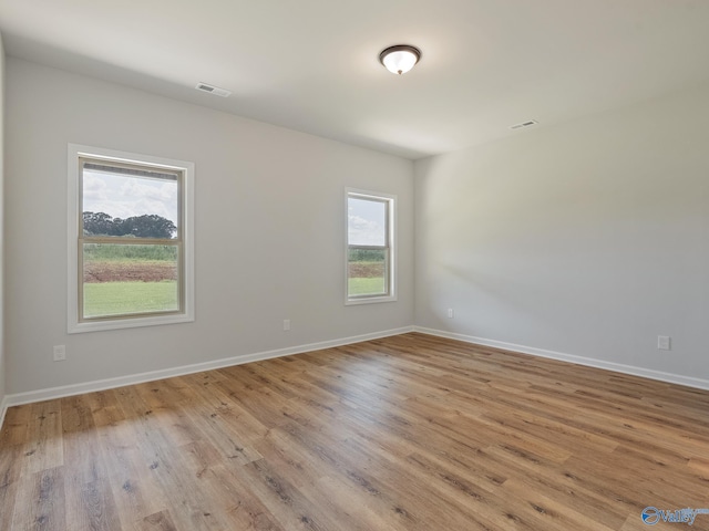 183 Saddle St, New Market, AL 35761 - unfurnished room featuring wood finished floors, baseboards, and visible vents