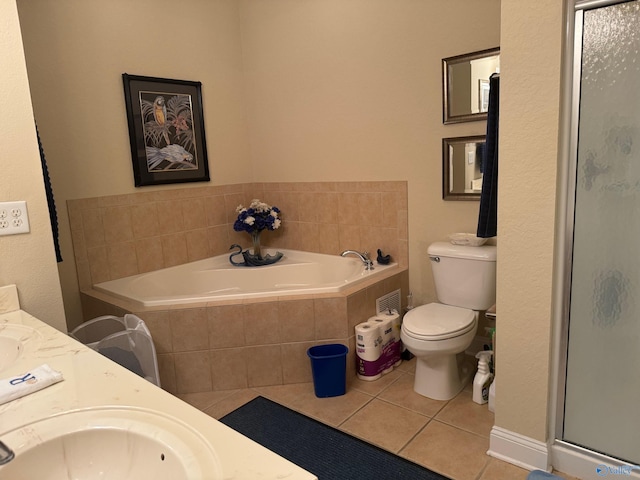 full bathroom featuring shower with separate bathtub, tile patterned floors, vanity, and toilet