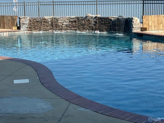 view of pool featuring pool water feature