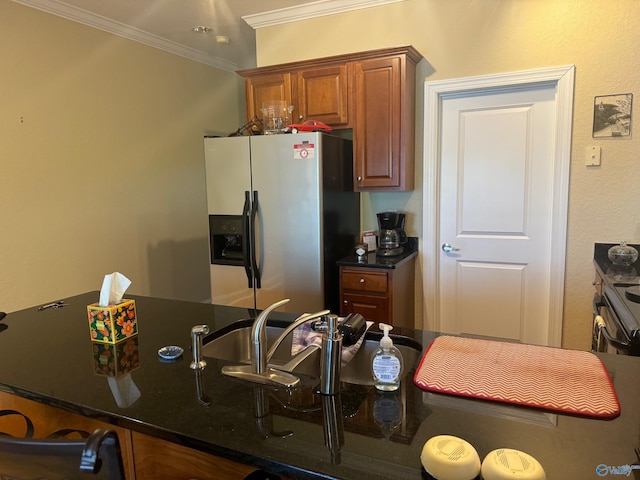 kitchen featuring ornamental molding, dark stone counters, and stainless steel appliances