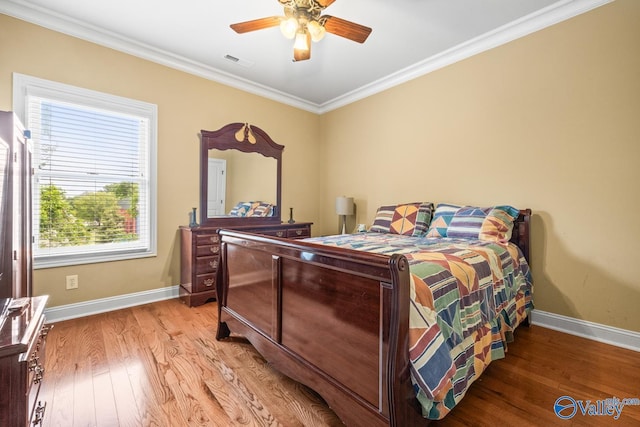 bedroom featuring visible vents, light wood-style flooring, and baseboards