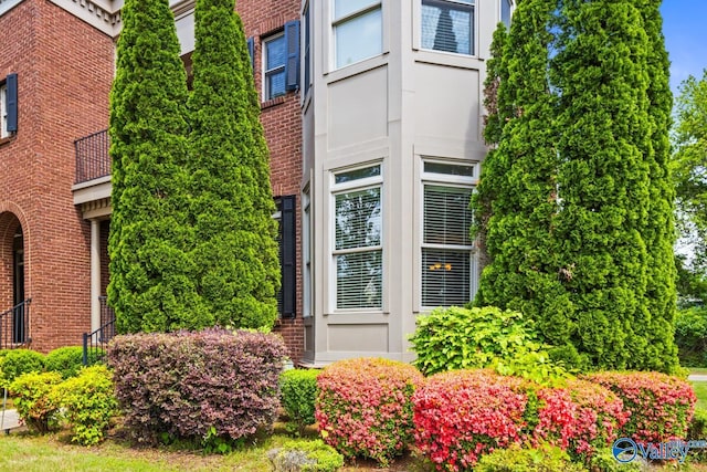 exterior space with brick siding