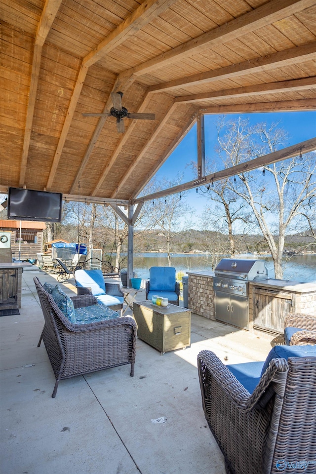 view of patio featuring a water view, area for grilling, grilling area, and outdoor lounge area