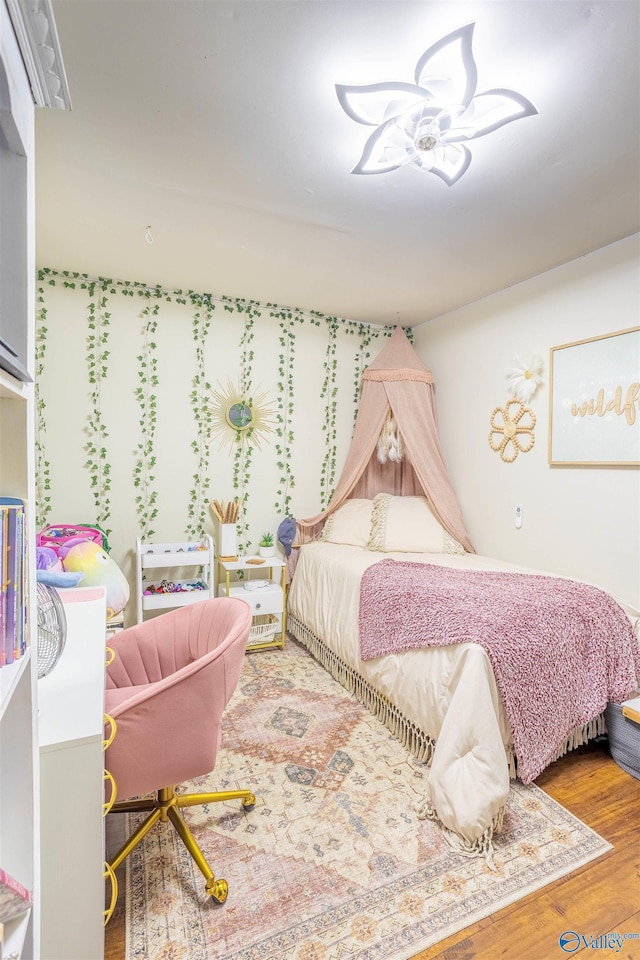 bedroom with wood-type flooring