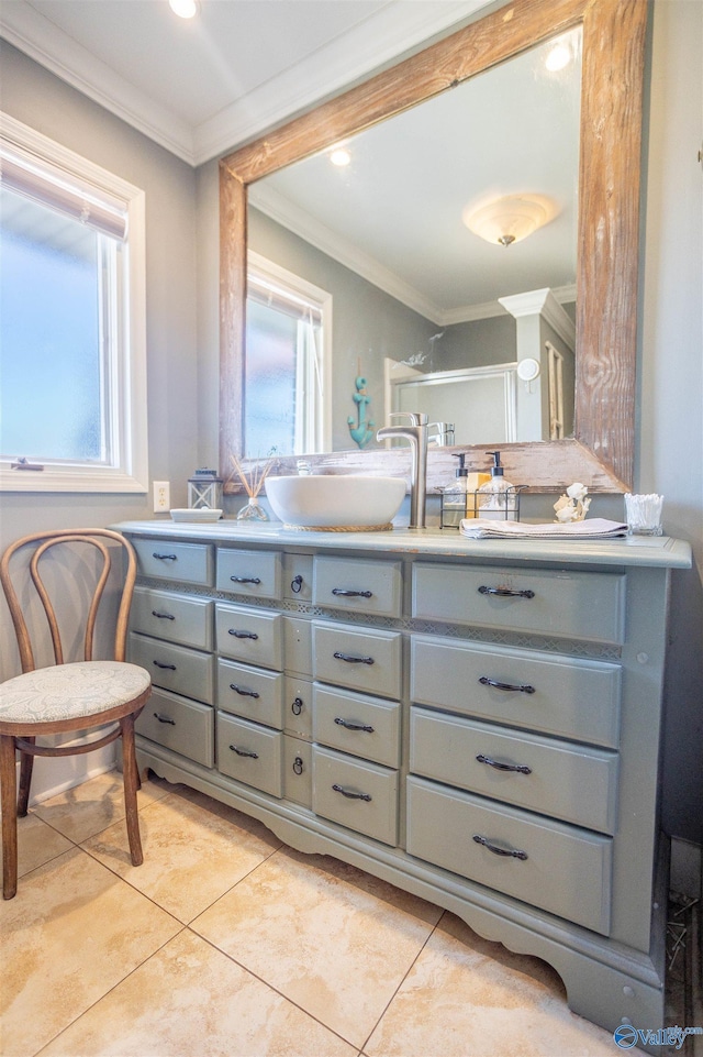 bathroom featuring tile patterned floors, ornamental molding, and vanity