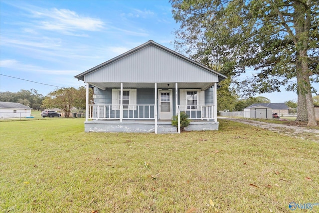 bungalow with a front lawn and a porch